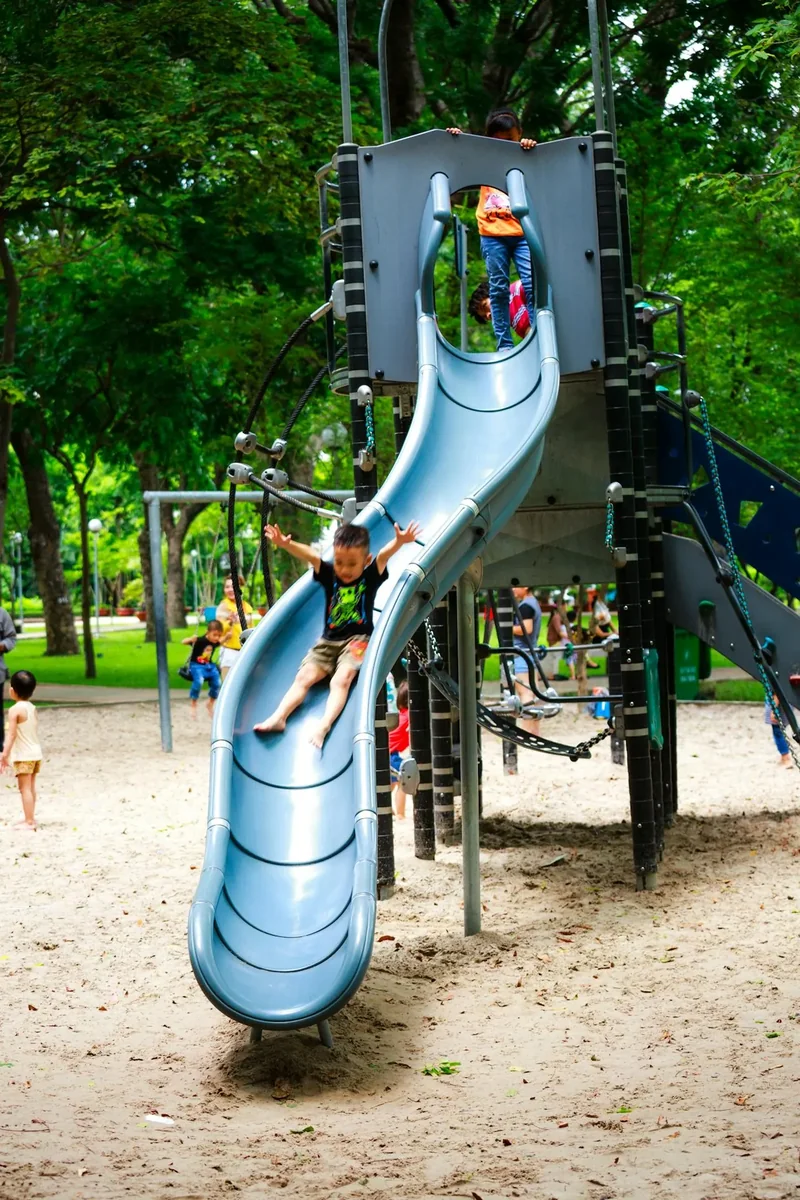A child playing on a playground slide